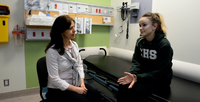 CHEO staff and youth in a hospital room