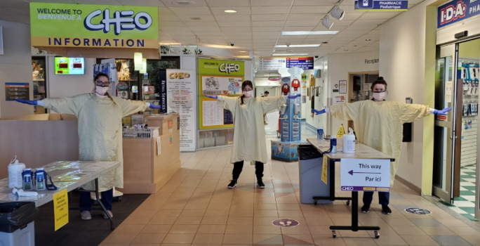 CHEO screening team in the main lobby, wearing PPE