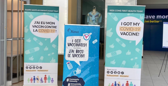 Photo of large banners with text saying "I got vaccinated!"