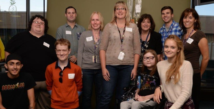 Group photo of CHEO's Youth Forum, smiling at the camera