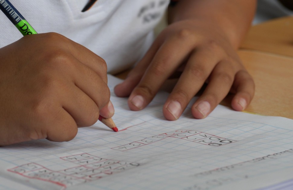 Child writing in notebook