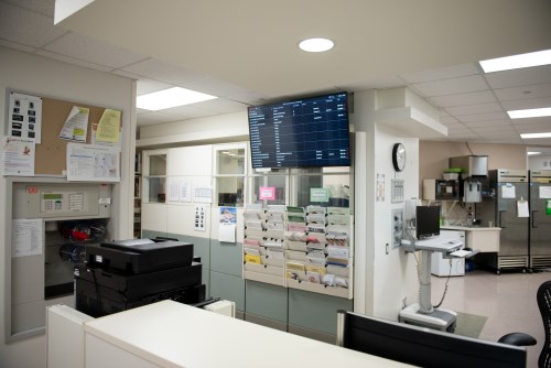 NICU clerk's desk, showing a monitor where each baby's location is shown.