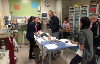 Staff gathered around a mannequin in our Emergency Department for a simulation