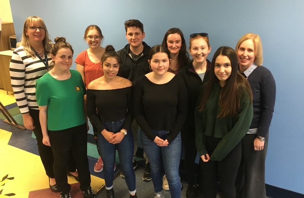 Youth Forum members pose together as a group in CHEO's cafeteria