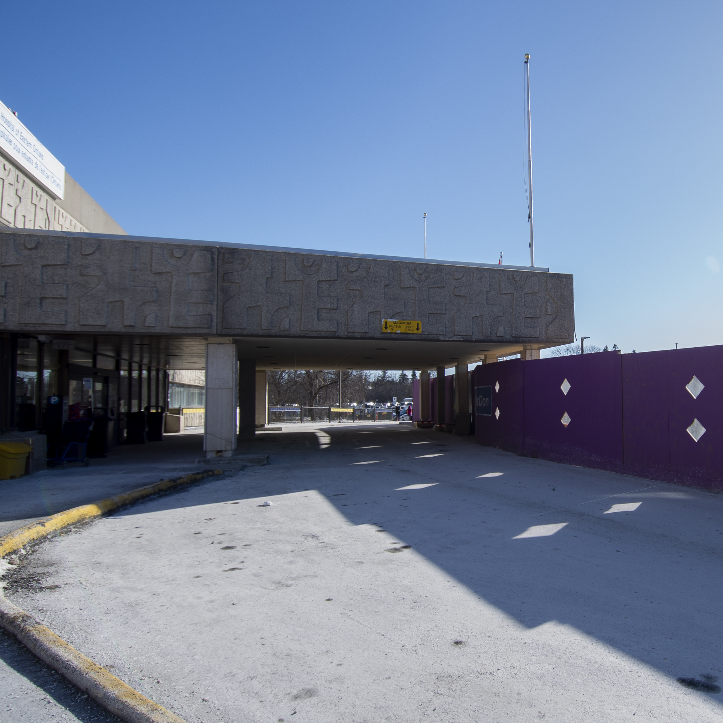 main entrance of cheo with hoarding for ITC and sunny sky