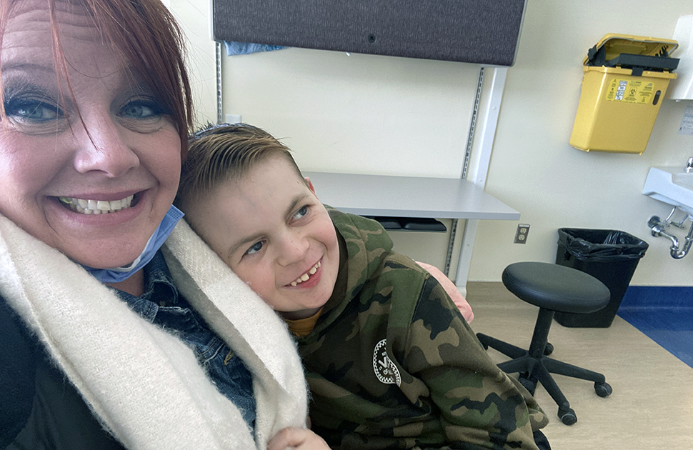 mother and son sit at CHEO waiting for appointment
