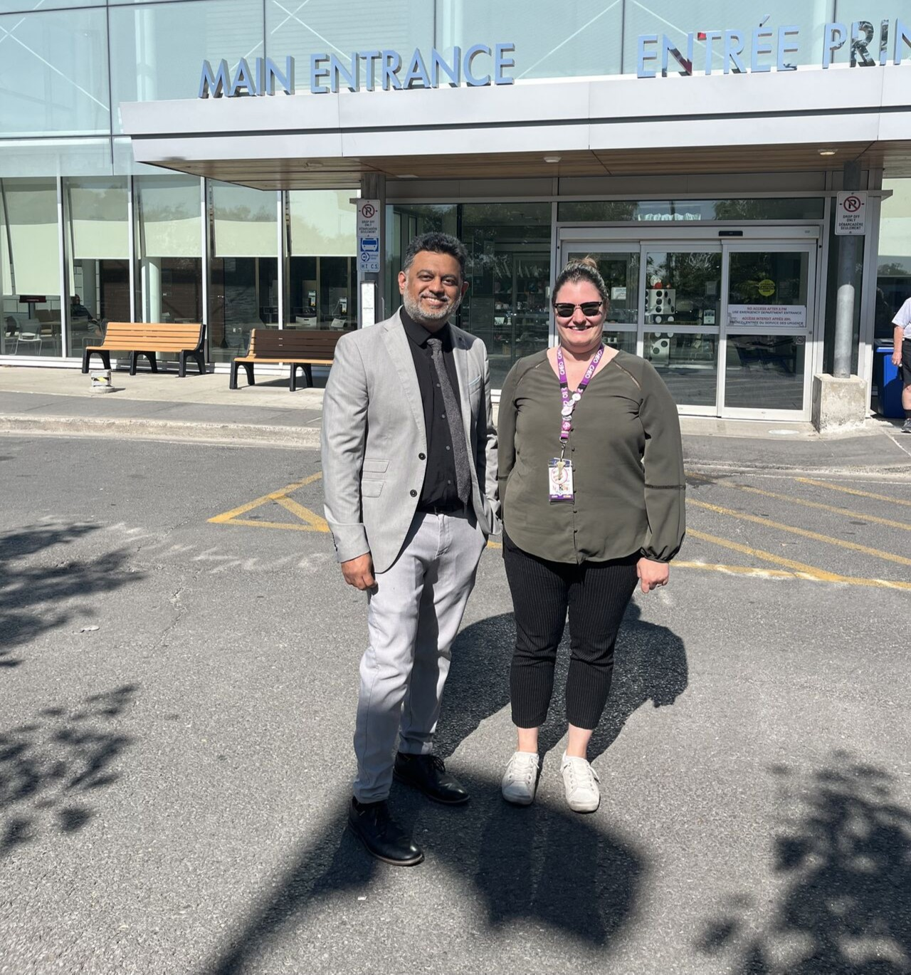 doctor and clinical manager from cheo stand in front of hospital in eastern ontario