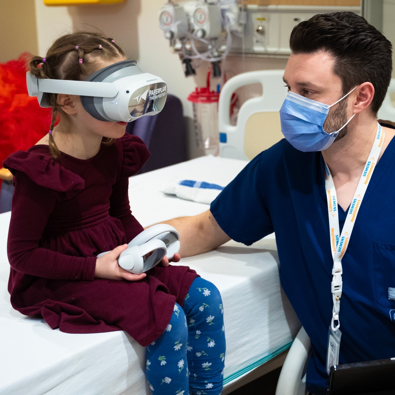 MRI technologist Matt Head with child using virtual reality before MRI