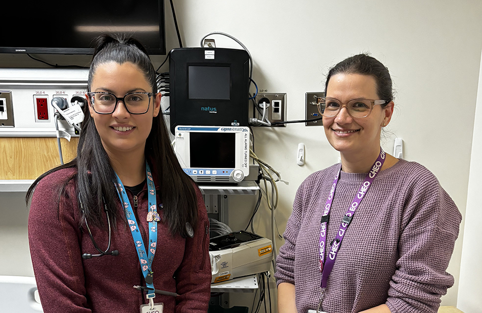 nurse practitioners stand in a sleep lab room