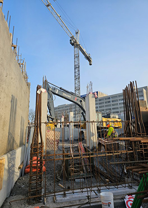 construction in progress of cheo parking garage with crane