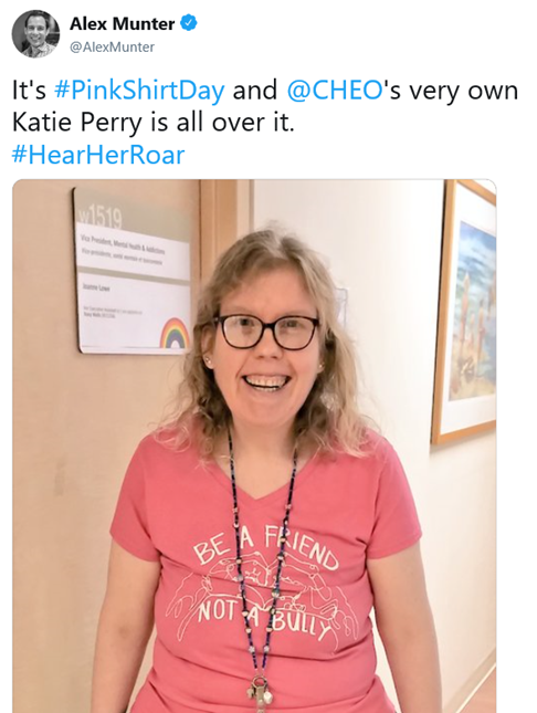 Tweet from @AlexMunter that says "It's Pink Shirt Day and CHEO's very own Katie Perry is all over it.", with a photo of Katie wearing a pink shirt