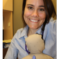 Photo of Kimberly Courtney holding a doll