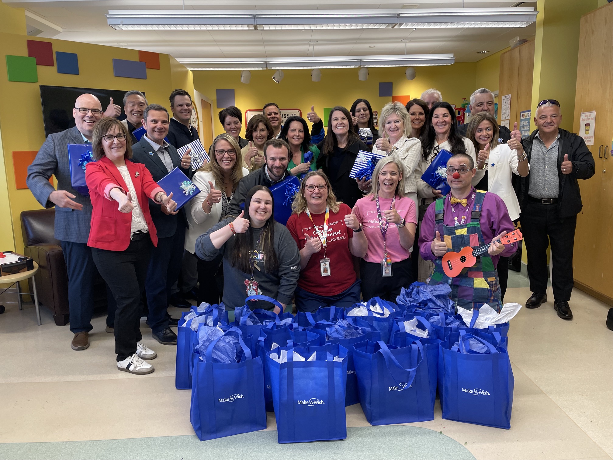 child life specialists pose with make-a-wish canada board of directors