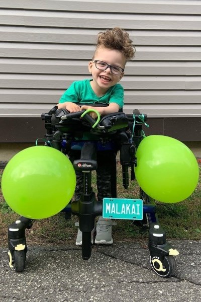 Malakai outside in his walker