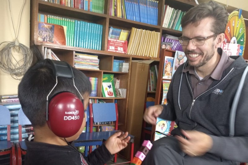 Doctor with iPad administering a hearing test with a child