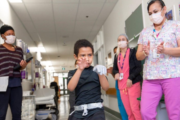 Vitaly dancing in a CHEO hallway