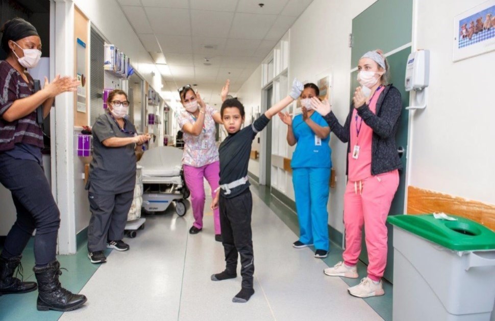 Vitaly dancing in a CHEO hallway