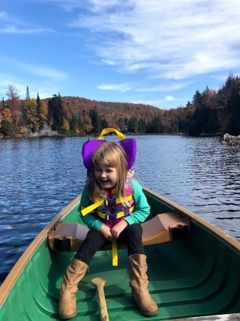 Young girl on a boat wearing a lifejacket