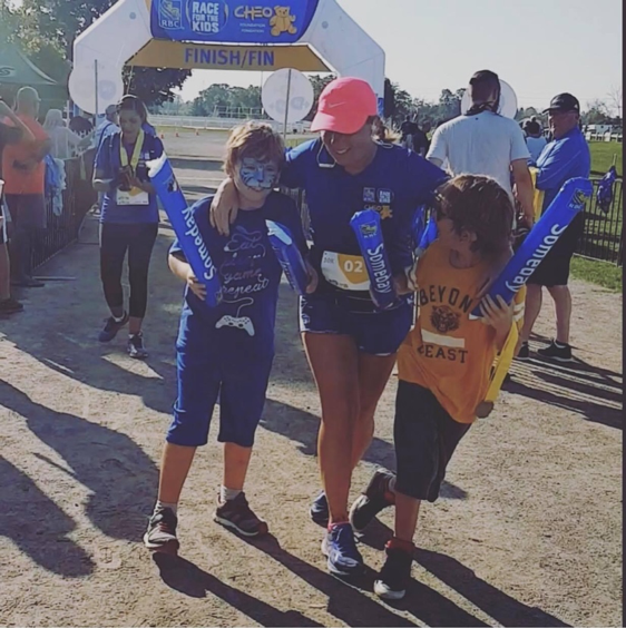 Sandra crossing the finish line