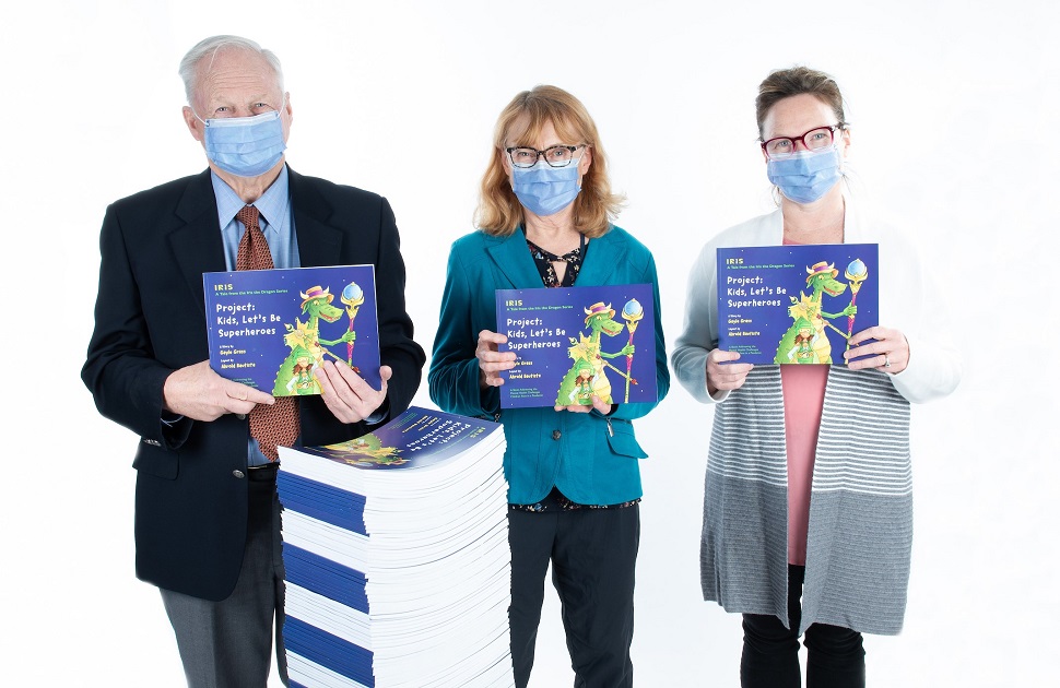 A man and two women holding books