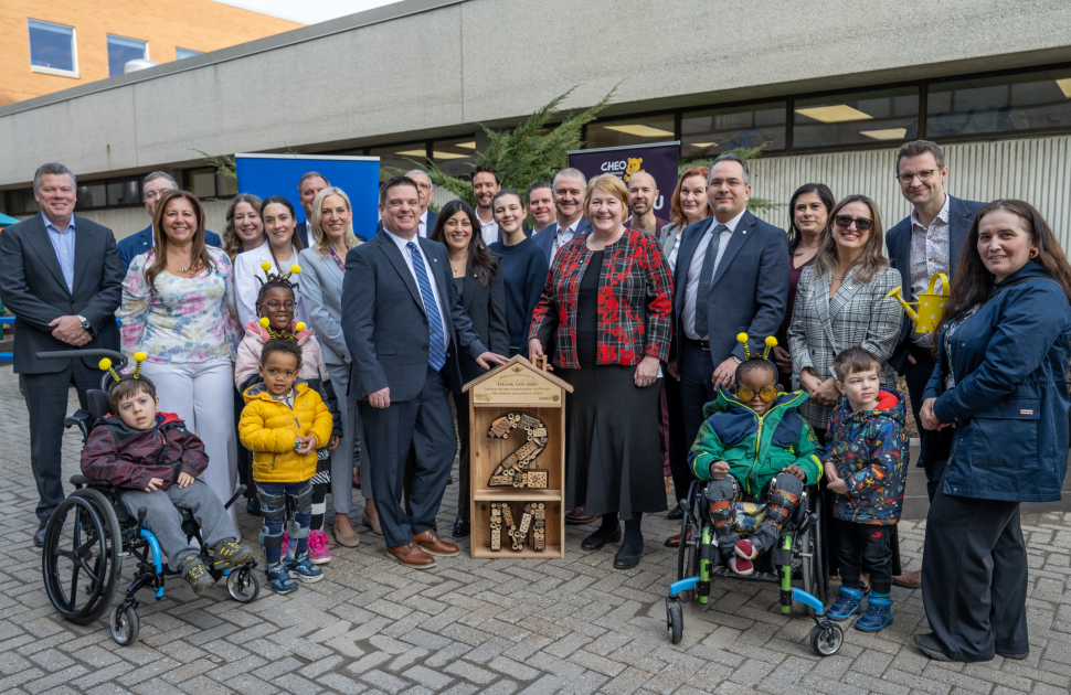people stand outside cheo to celebrate BMO investment