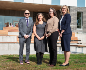 three nursing leaders and head of cheo research institute stand outside conference building at uottawa