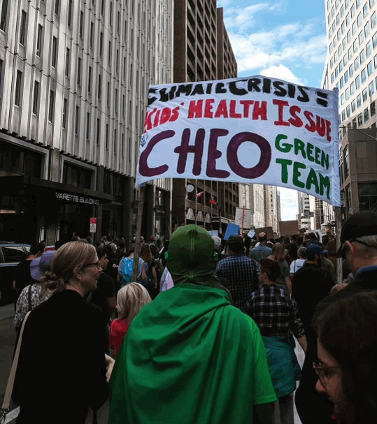 CHEO's Dr. Curtis Lavoie, in green, participating in the 2019 Climate Strike Protest