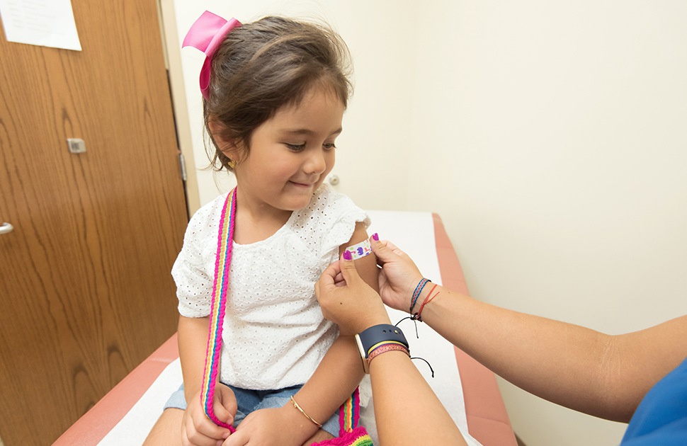 Happy child after getting immunized