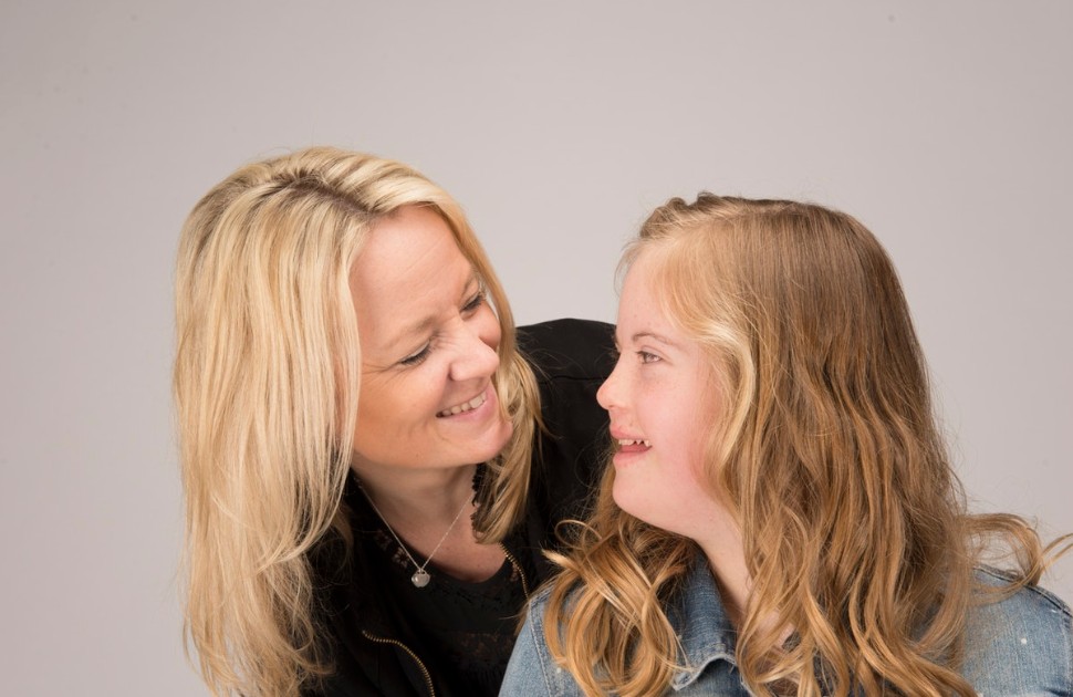 Mother and child smiling at camera