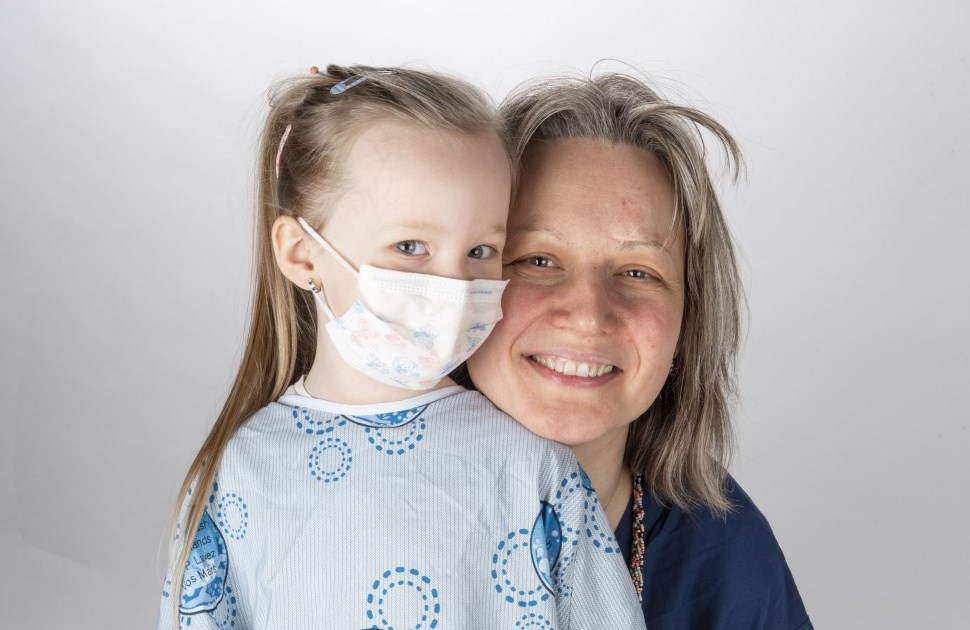 Daughter in a hospital gown with her mother